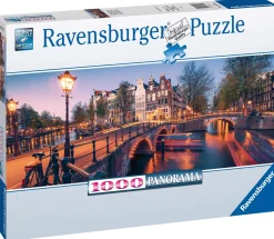 Ravensburger Panorama|Steden En Gebouwen<Avond in Amsterdam - panoramische legpuzzel van 1000 stukjes